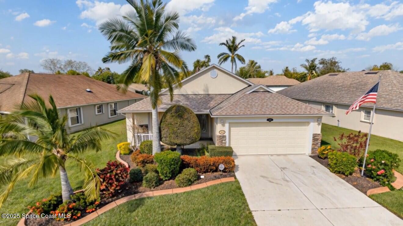 1664 Boca Rio Drive Melbourne, FL 32940 - Photo 1 of 46 a front view of a house with garden