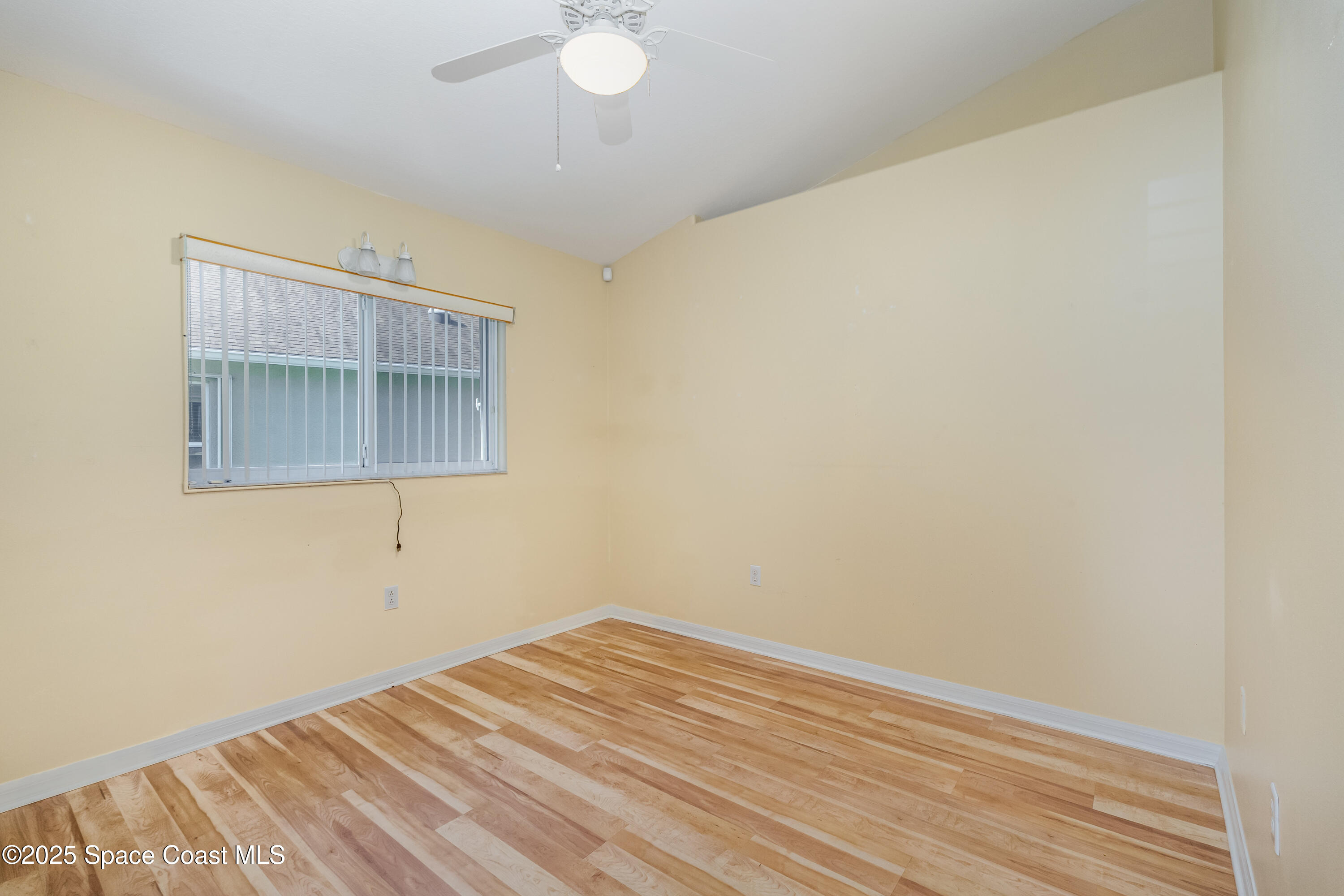 1664 Boca Rio Drive Melbourne, FL 32940 - Photo 15 of 46 a view of empty room with wooden floor