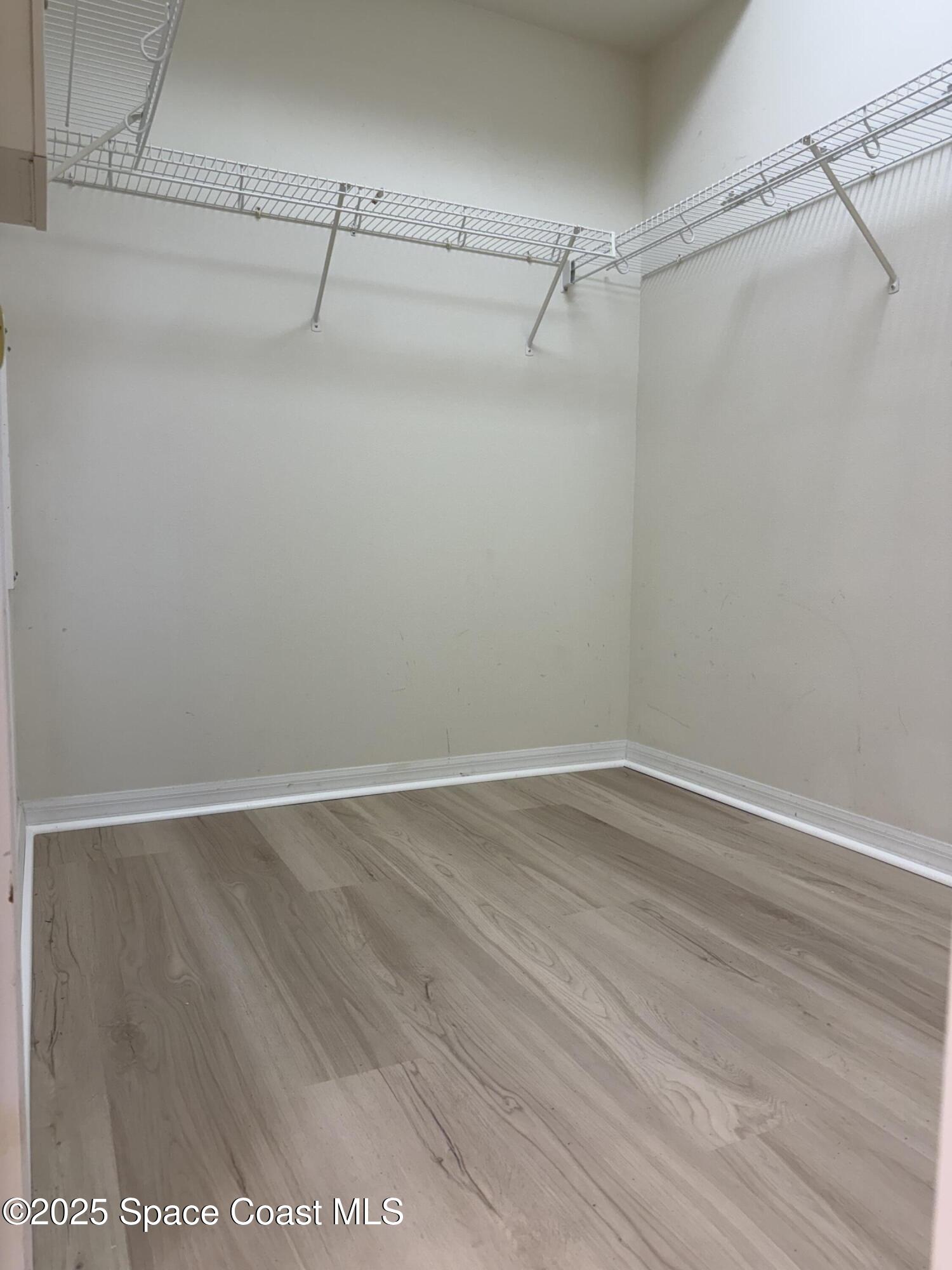 1664 Boca Rio Drive Melbourne, FL 32940 - Photo 20 of 46 a view of a room with racks on the wall