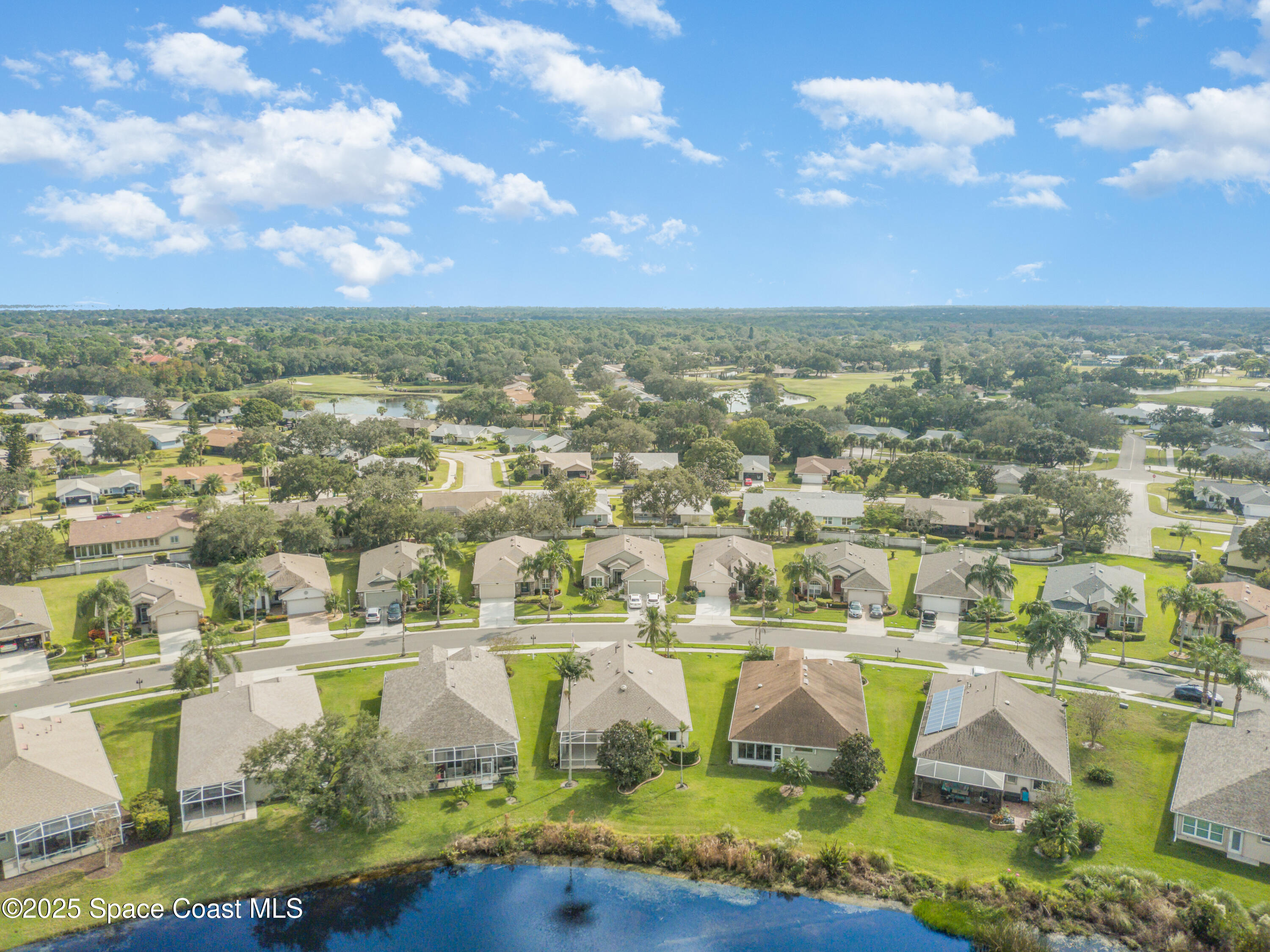 1664 Boca Rio Drive Melbourne, FL 32940 - Photo 32 of 46 an aerial view of residential houses with outdoor space and swimming pool