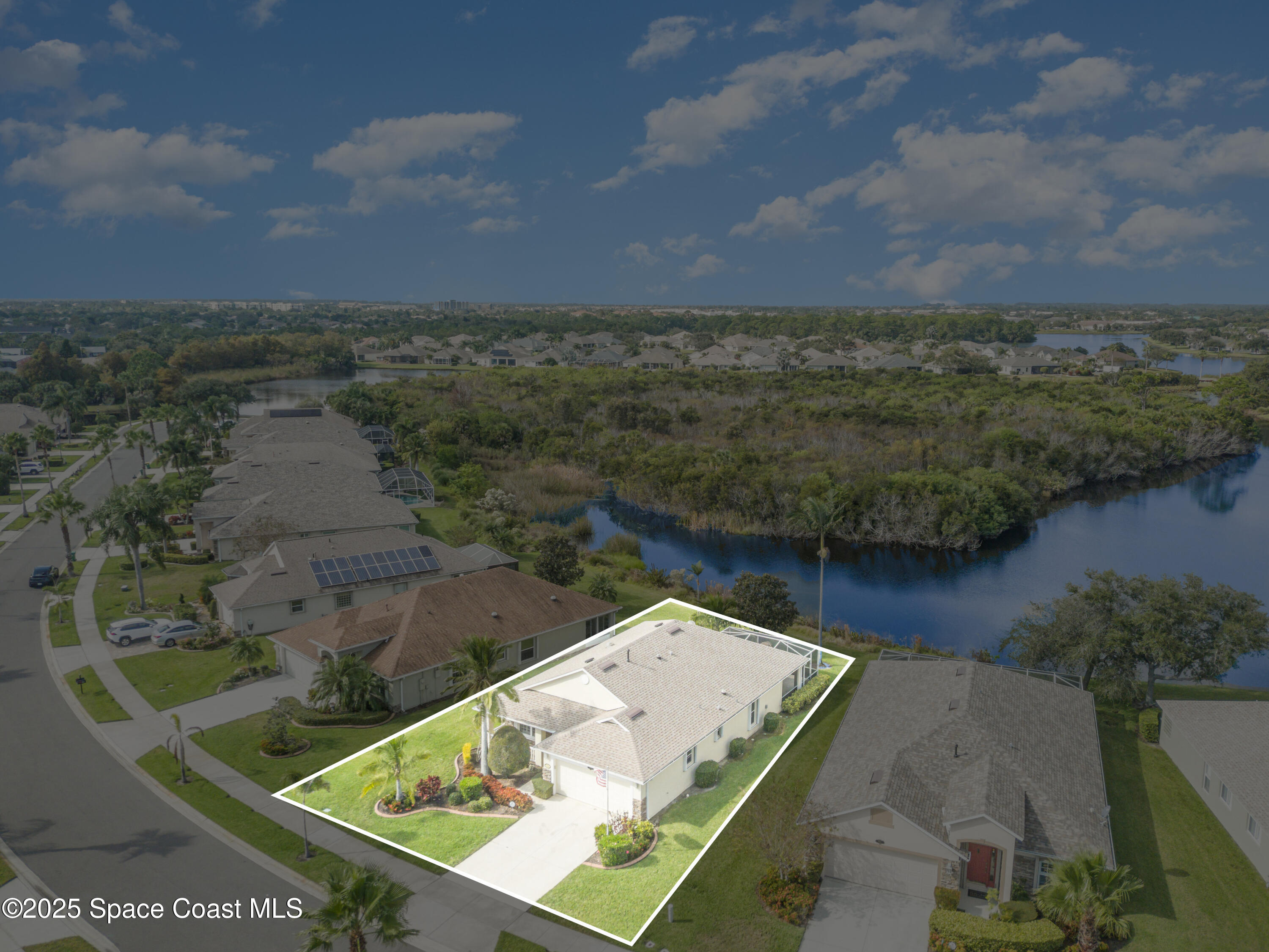 1664 Boca Rio Drive Melbourne, FL 32940 - Photo 33 of 46 an aerial view of house with yard and seating