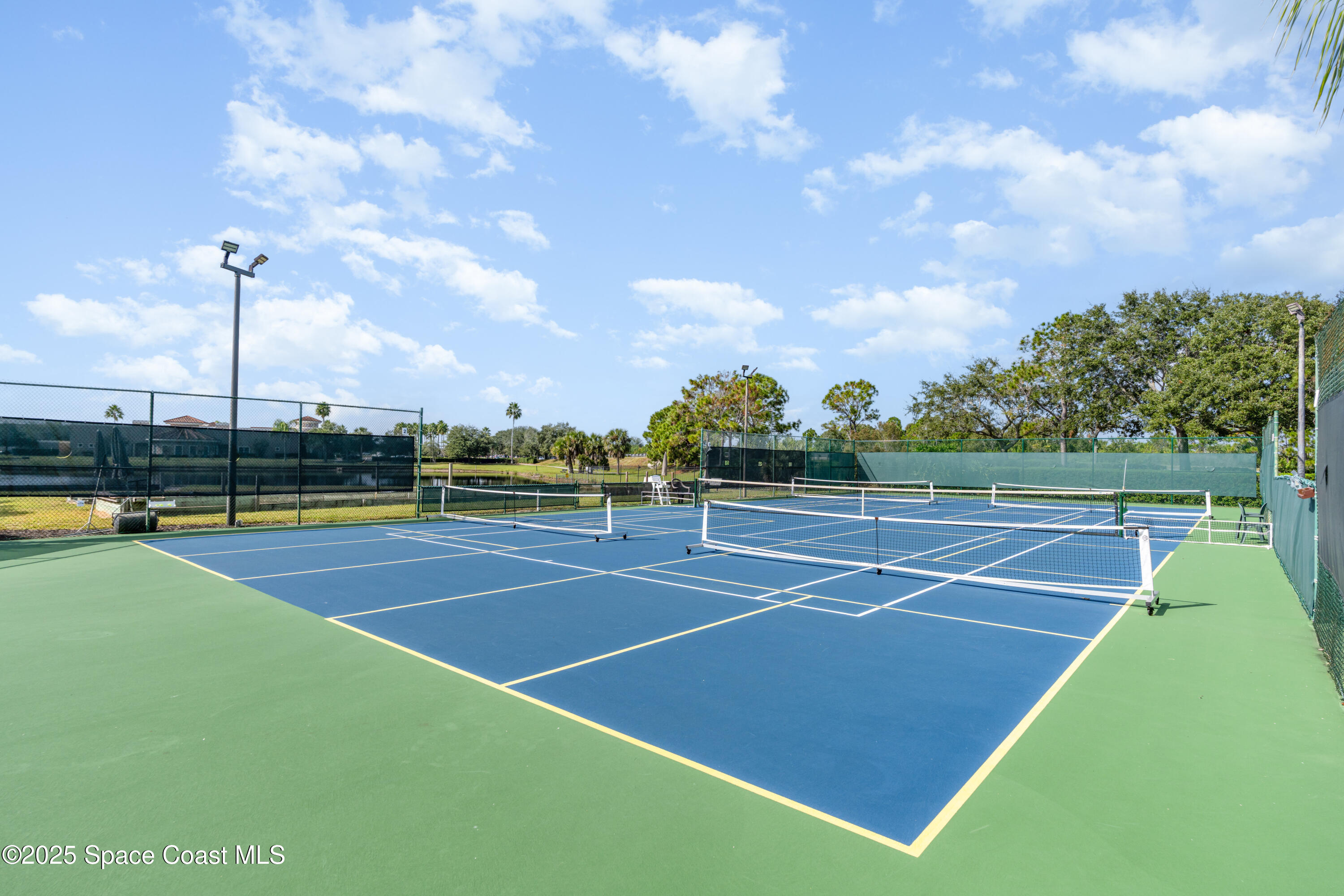 1664 Boca Rio Drive Melbourne, FL 32940 - Photo 38 of 46 a view of an outdoor space and tennis court
