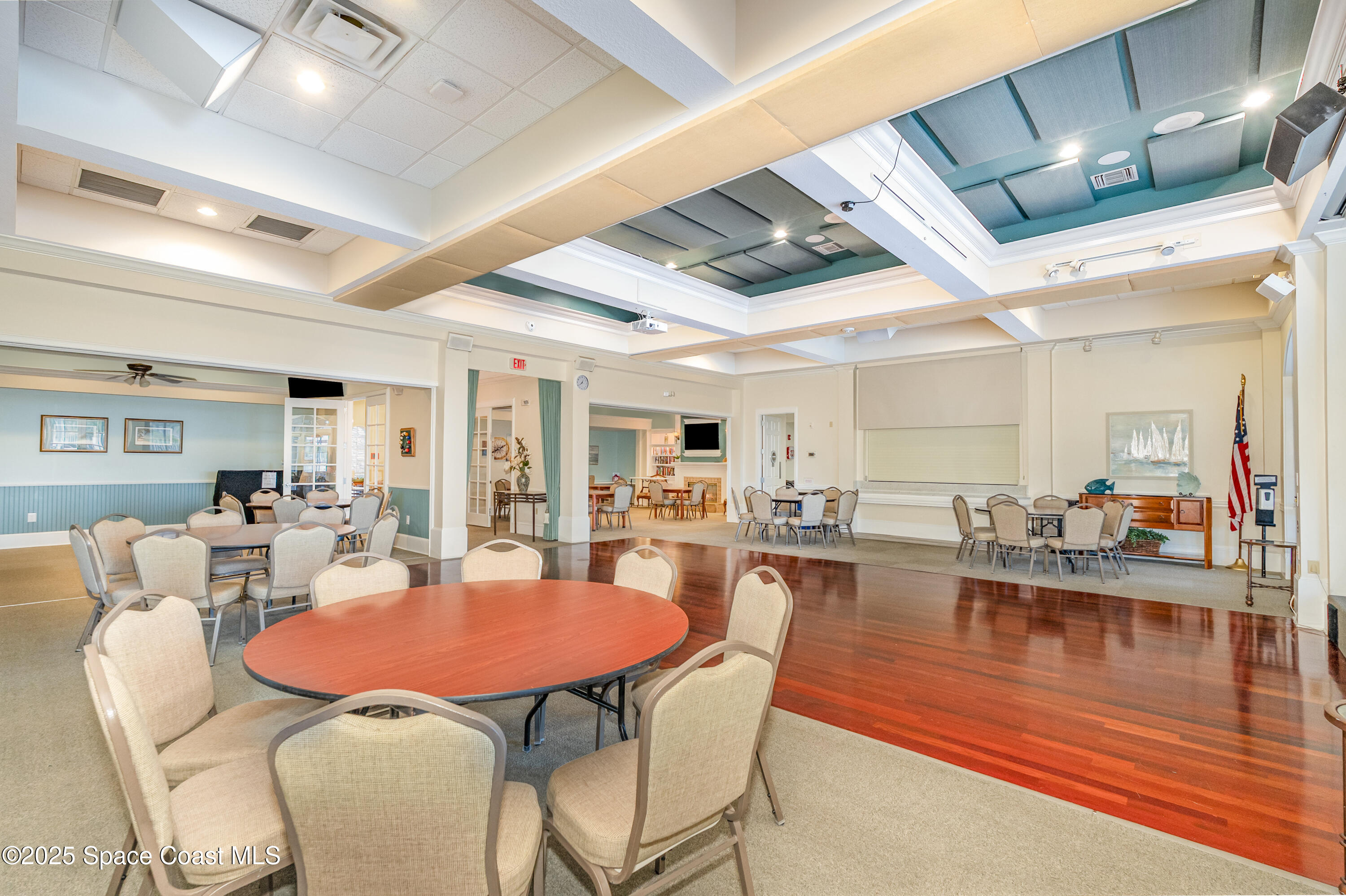 1664 Boca Rio Drive Melbourne, FL 32940 - Photo 41 of 46 a dining room with furniture a rug and wooden floor