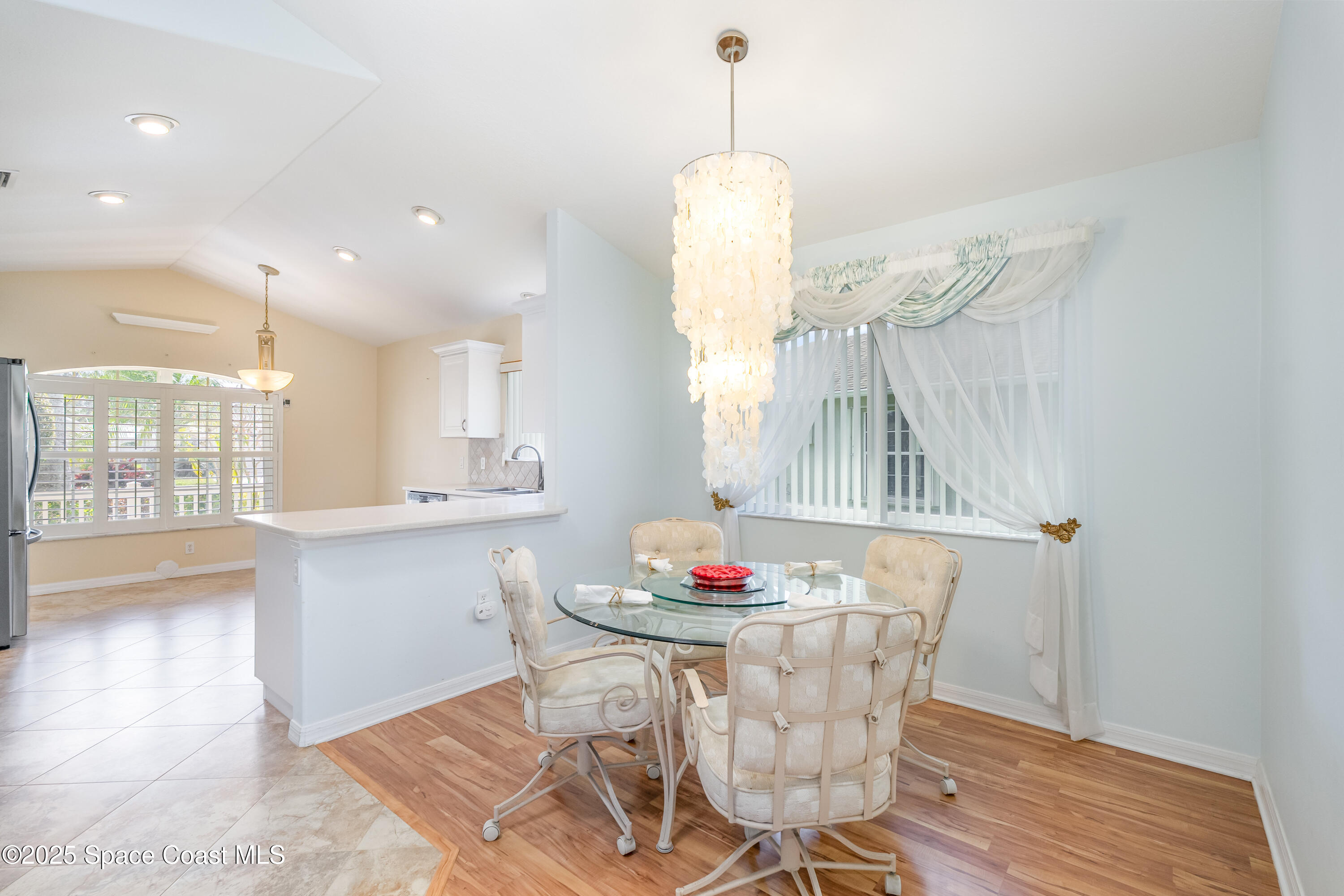 1664 Boca Rio Drive Melbourne, FL 32940 - Photo 10 of 46 a dining room with furniture and window