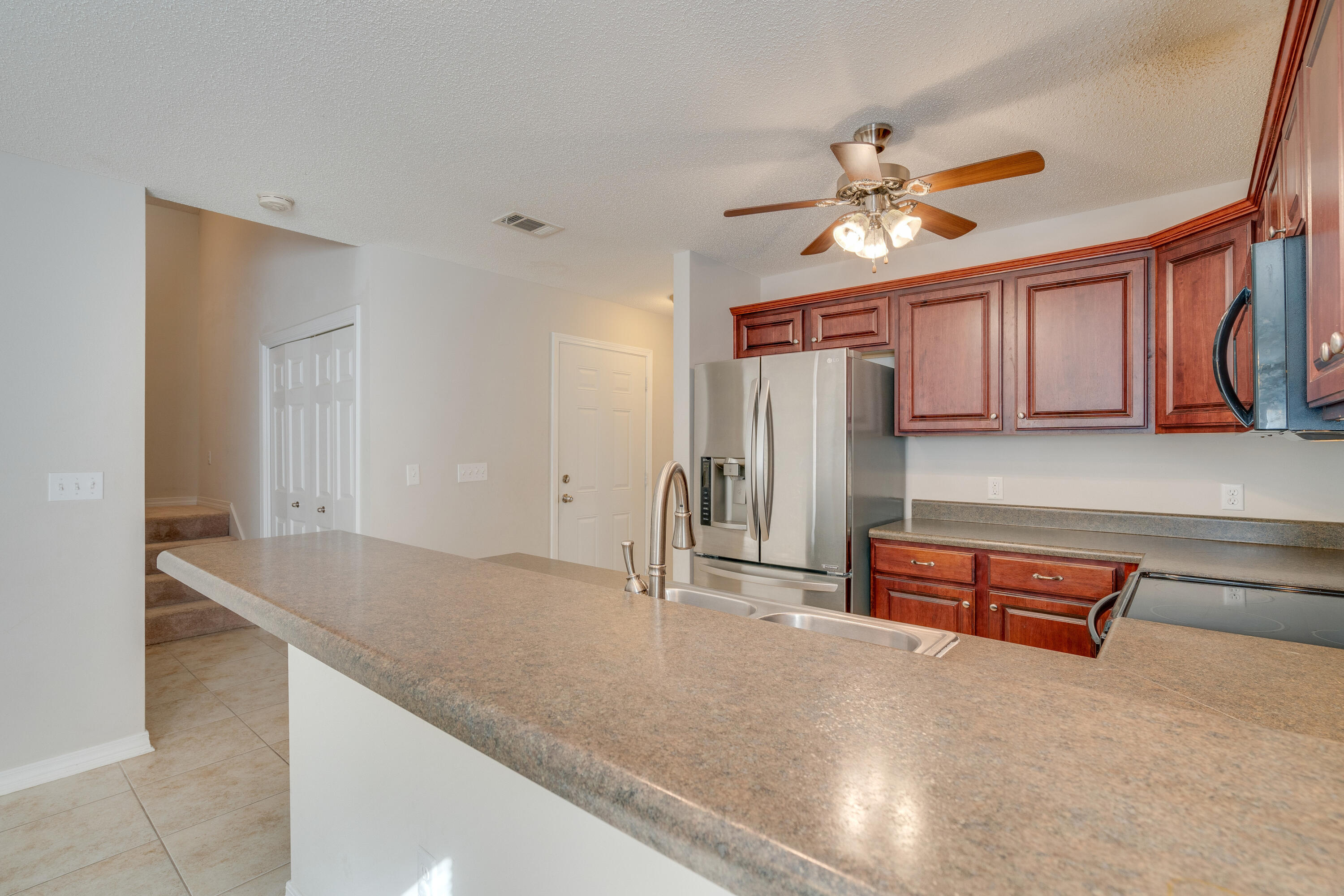 315 Dahlquist Drive Crestview, FL 32539 - Photo 12 of 32 a view of livingroom with hardwood floor and ceiling fan