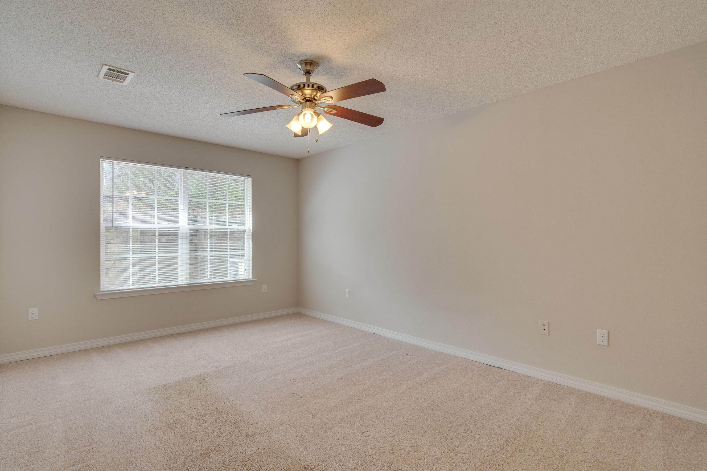 315 Dahlquist Drive Crestview, FL 32539 - Photo 17 of 32 a view of an empty room with a window