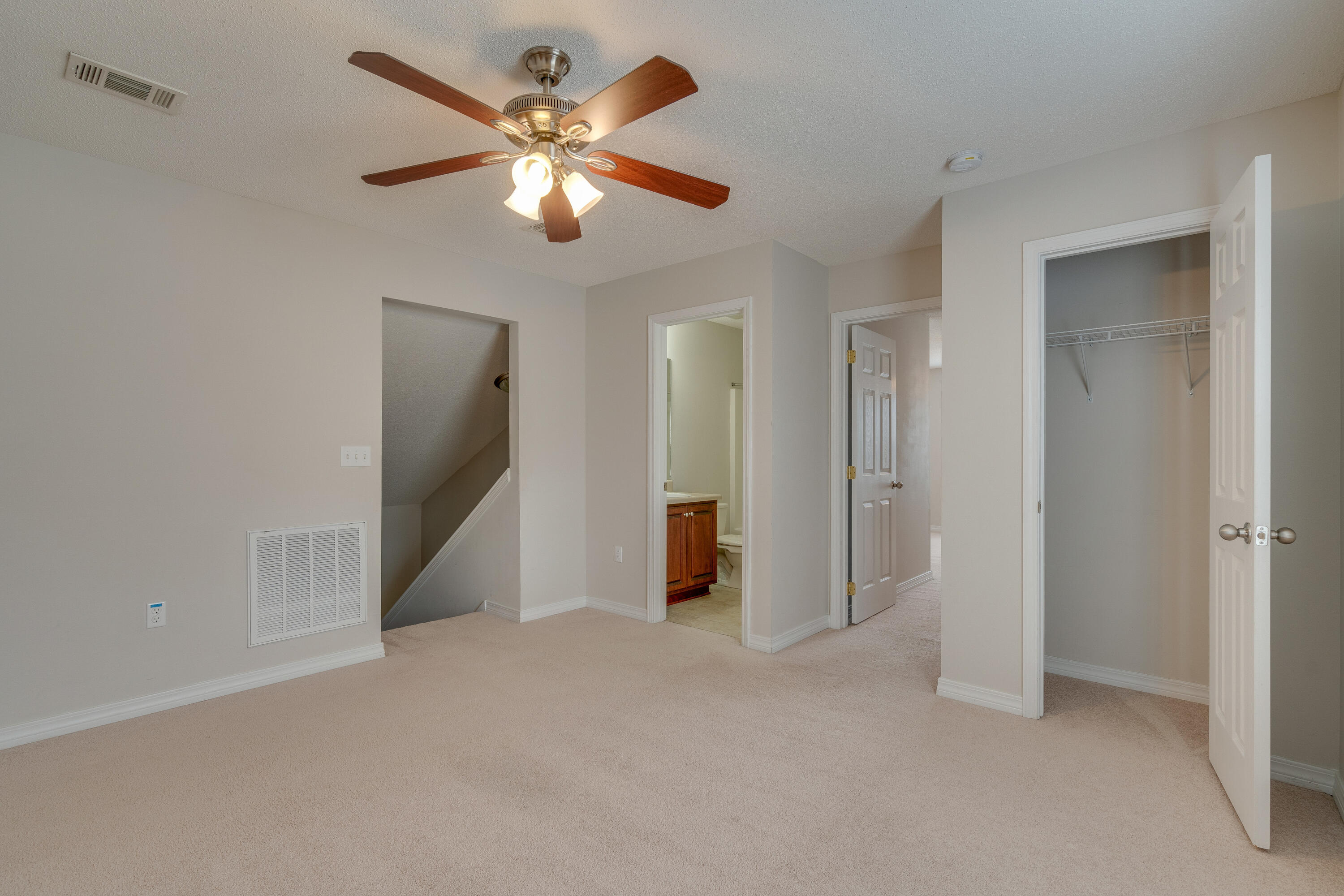 315 Dahlquist Drive Crestview, FL 32539 - Photo 23 of 32 an empty room with closet and a ceiling fan