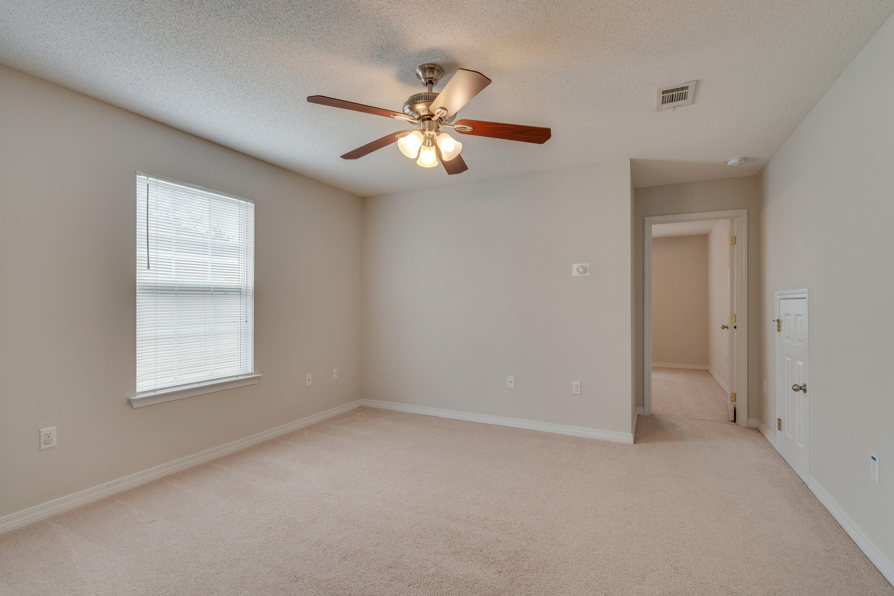 315 Dahlquist Drive Crestview, FL 32539 - Photo 24 of 32 an empty room with windows and fan
