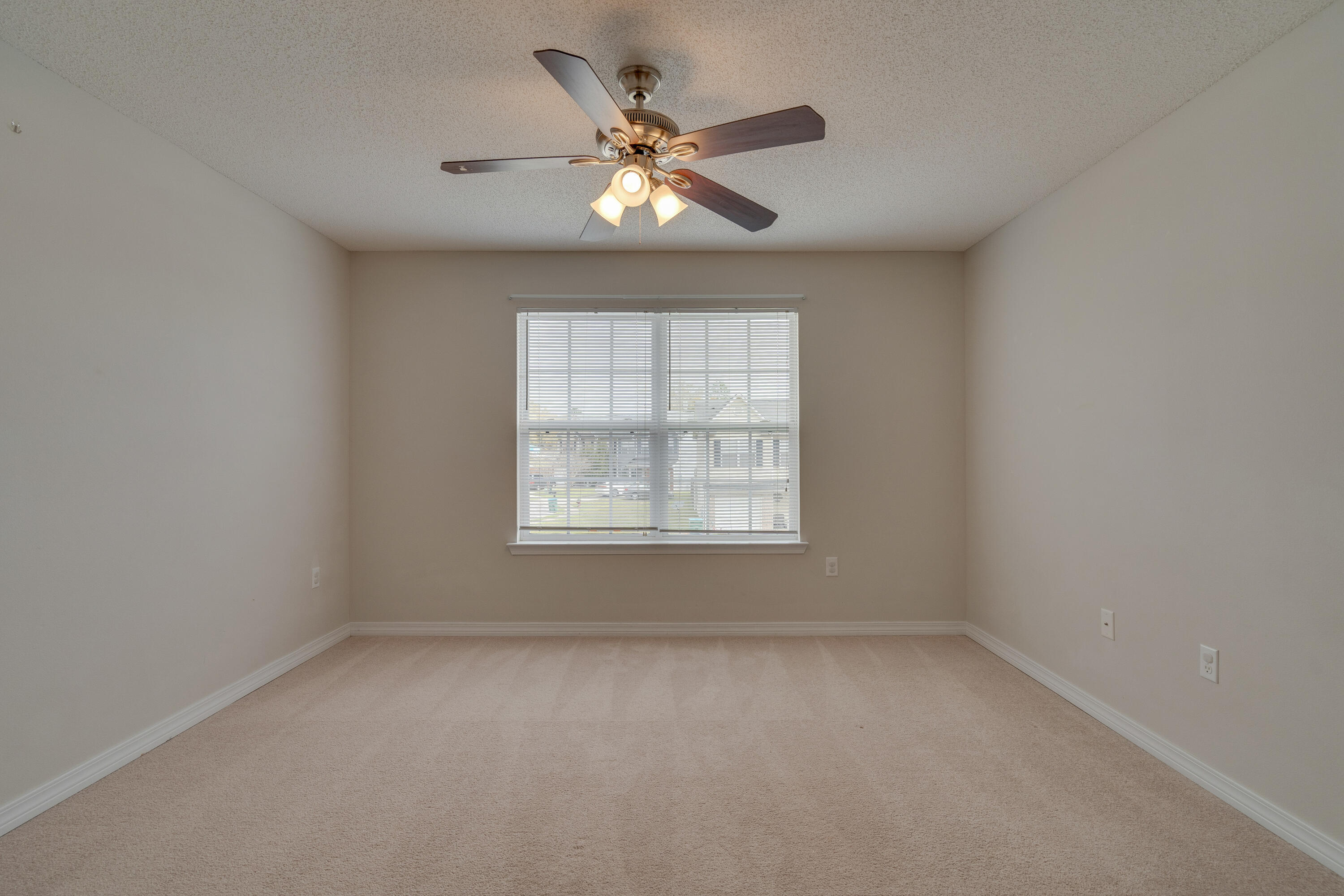 315 Dahlquist Drive Crestview, FL 32539 - Photo 25 of 32 an empty room with window and ceiling fan