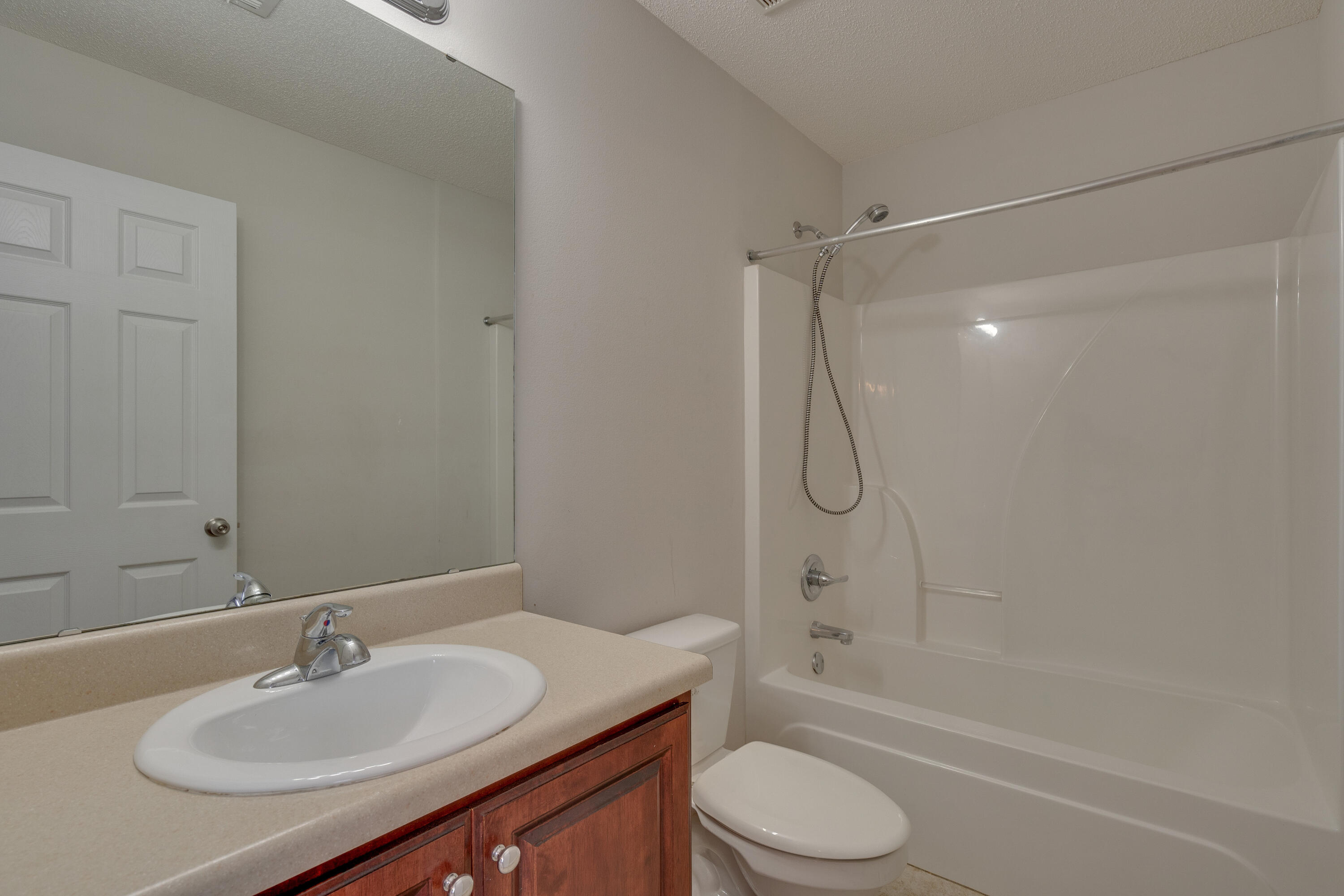 315 Dahlquist Drive Crestview, FL 32539 - Photo 26 of 32 a bathroom with a granite countertop sink toilet and shower