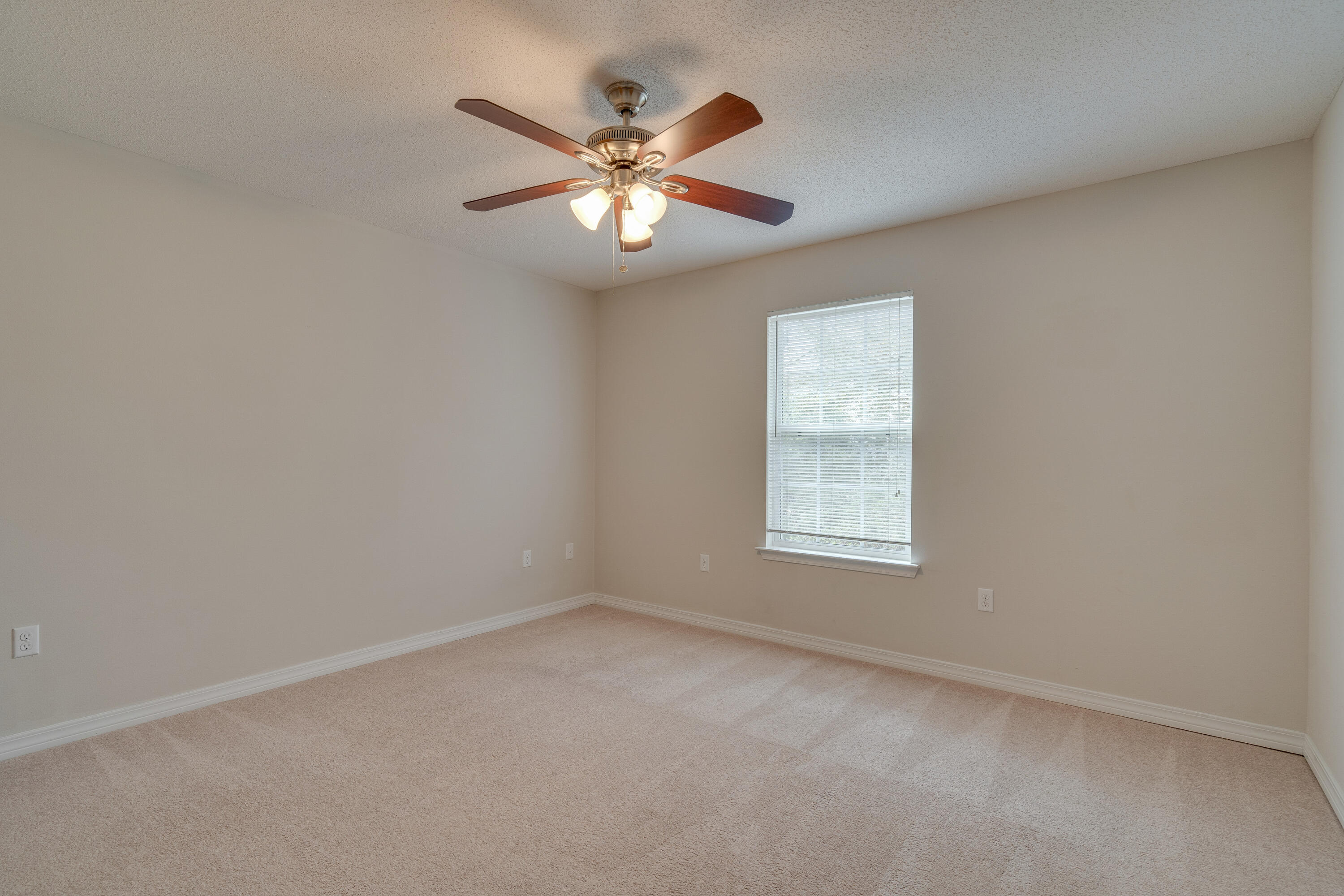 315 Dahlquist Drive Crestview, FL 32539 - Photo 27 of 32 an empty room with window and fan