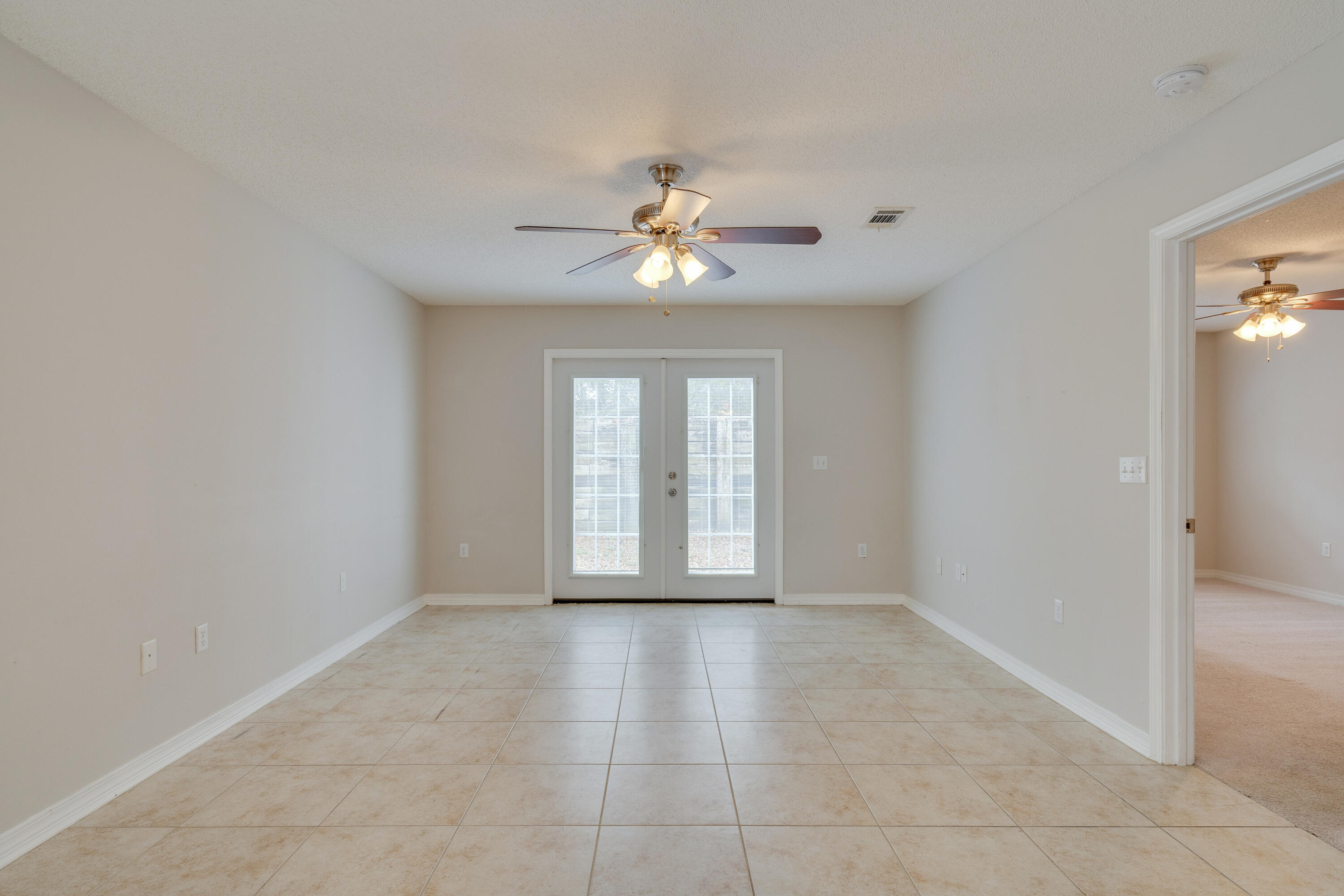 315 Dahlquist Drive Crestview, FL 32539 - Photo 6 of 32 a view of an empty room with a window