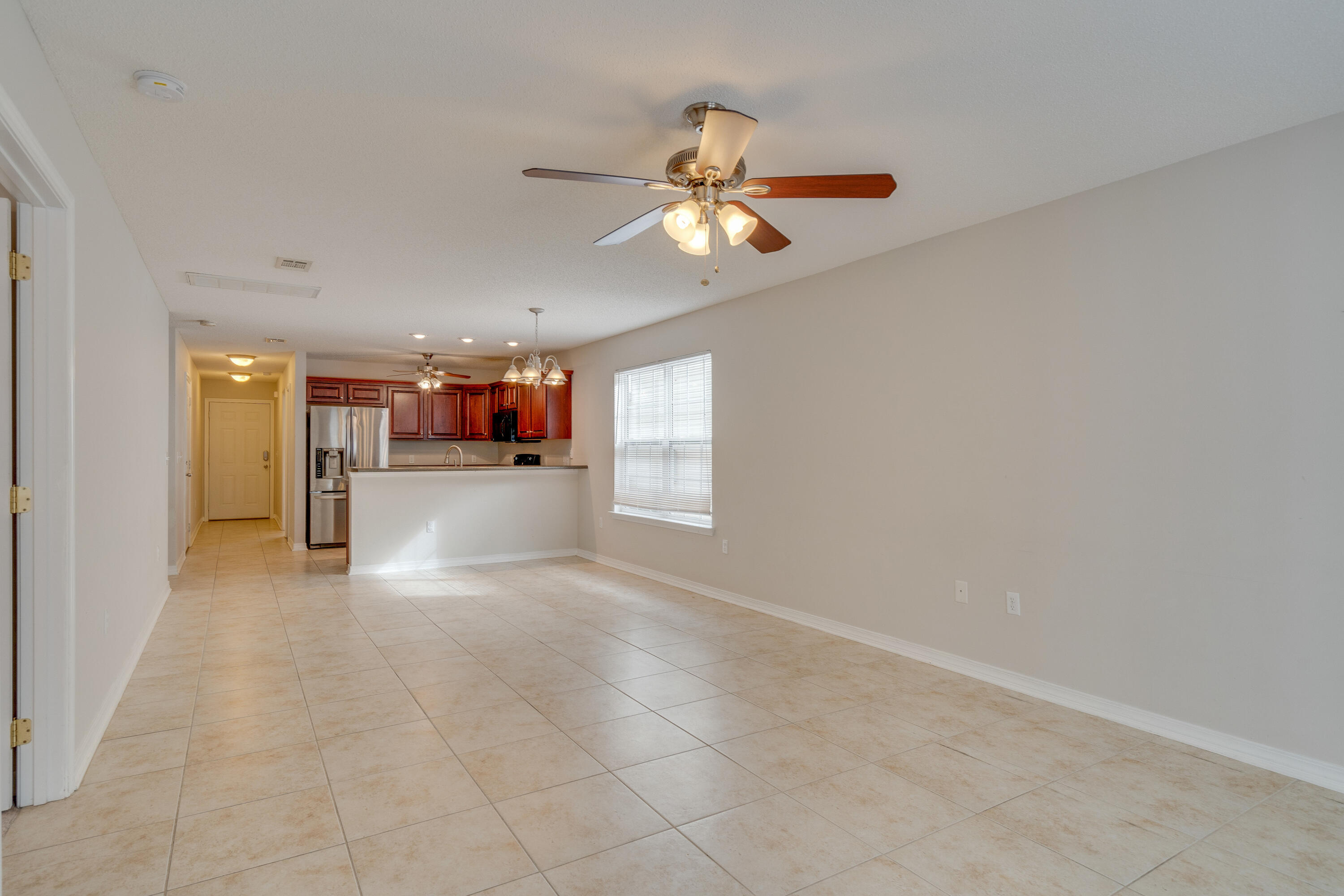315 Dahlquist Drive Crestview, FL 32539 - Photo 8 of 32 a view of a livingroom with a ceiling fan and window