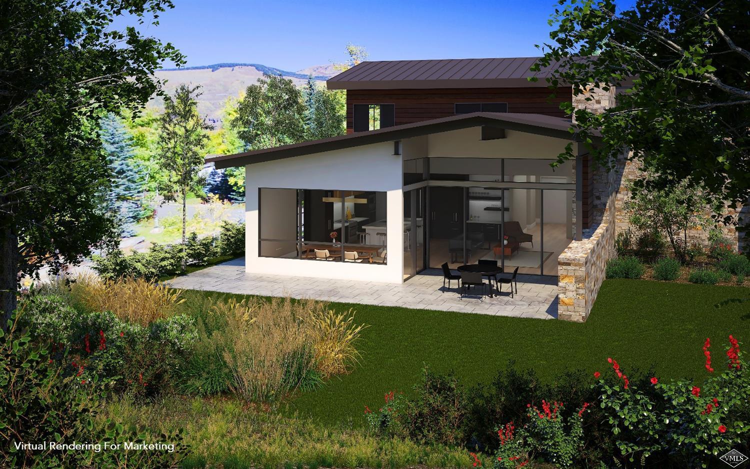 4296 Nugget Lane Vail, CO 81657 - Photo 7 of 7 a view of a house with backyard sitting area and garden