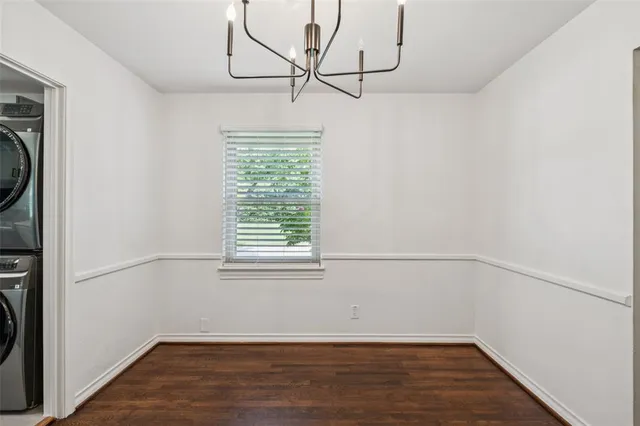 a view of a room with rack on the wall and wooden floor