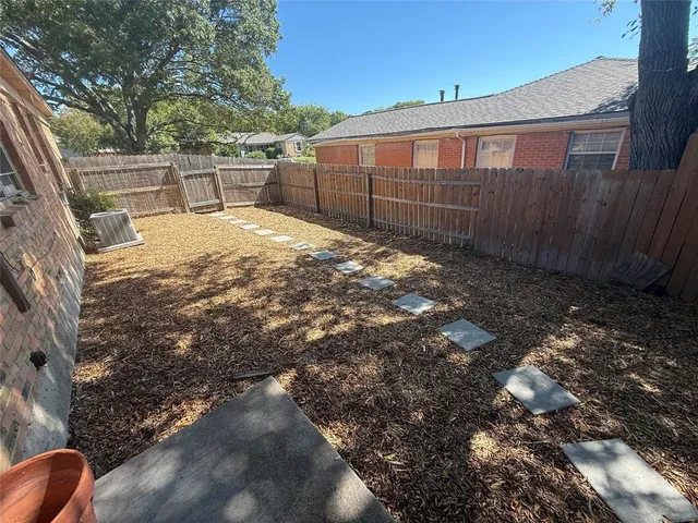 a backyard of a house with lots of green space
