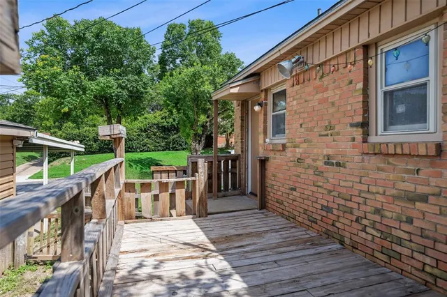 a view of a pathway with a wooden deck