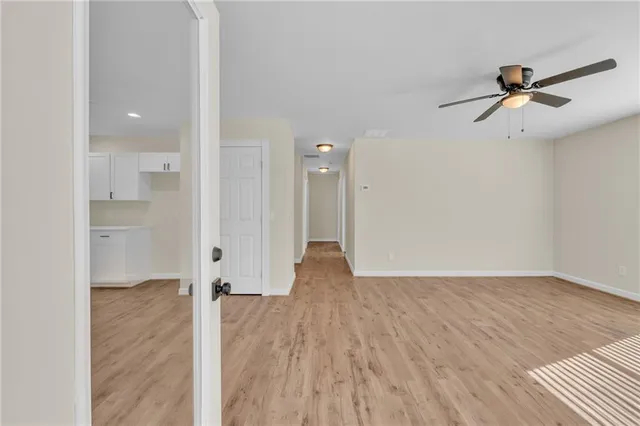 a view of an empty room with a window