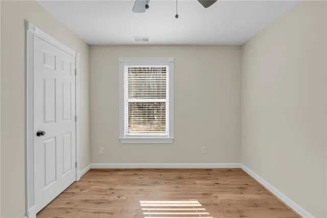 a white toilet sitting next to a bath tub