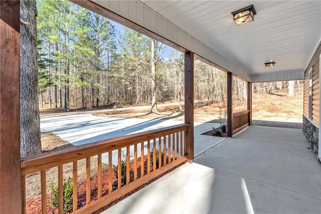 a view of a porch and wooden floor