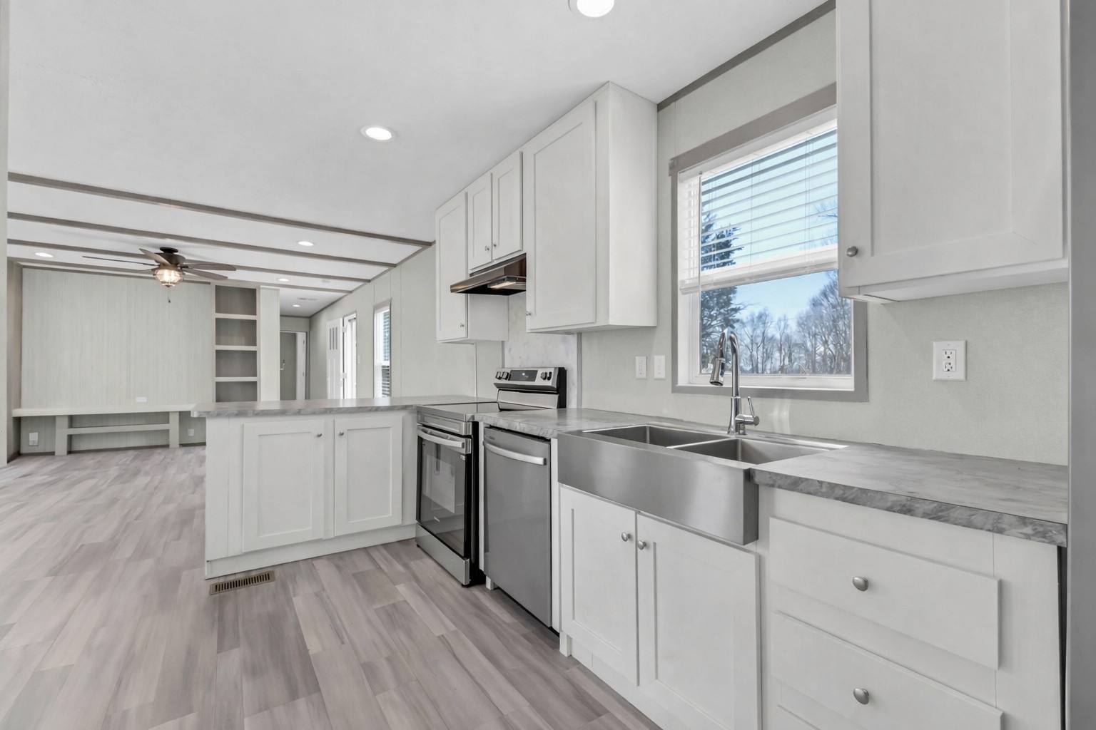 4819 Tarsus Road Palmyra, TN 37142 - Photo 13 of 15 a kitchen with granite countertop cabinets stainless steel appliances a sink and a window