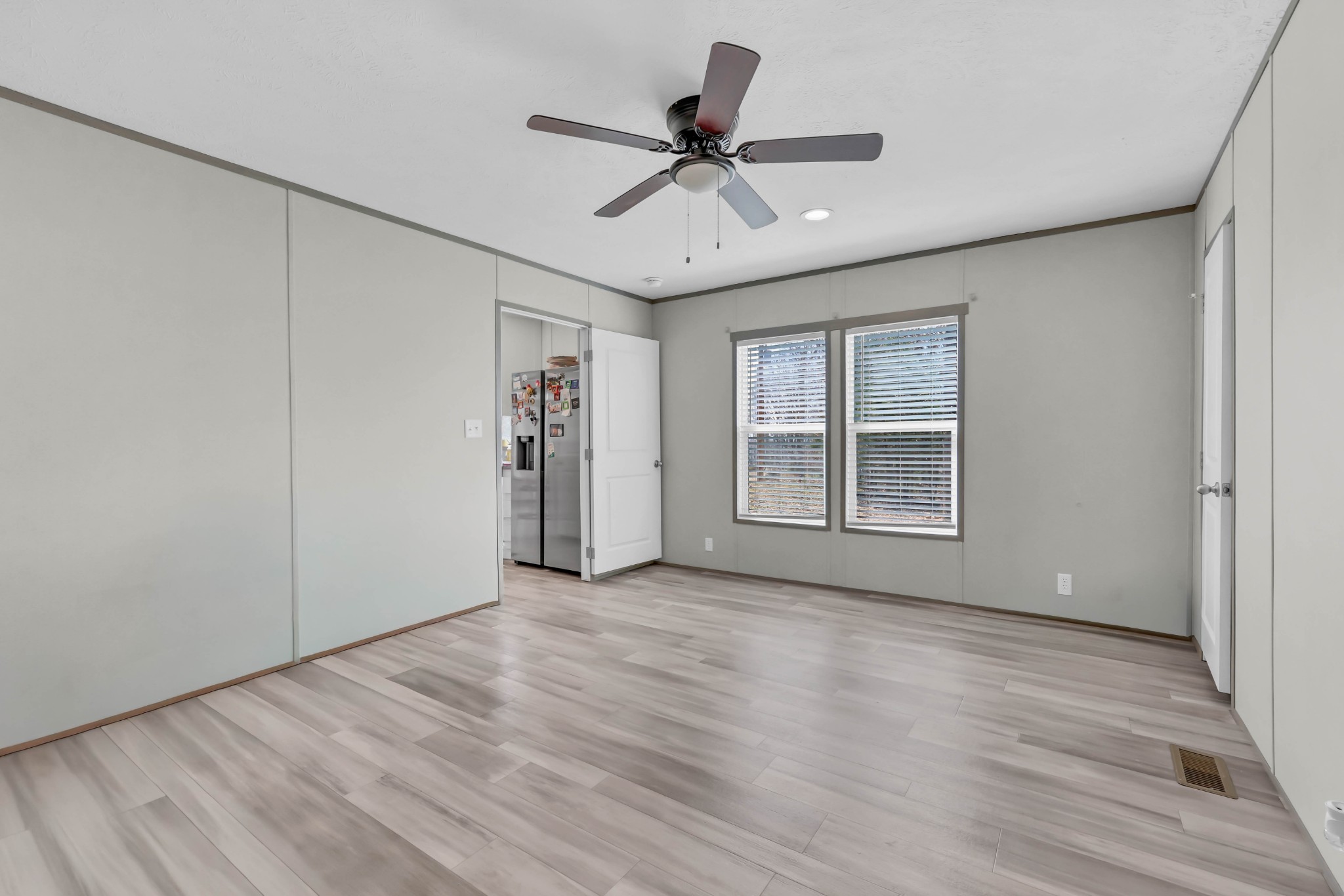 4819 Tarsus Road Palmyra, TN 37142 - Photo 8 of 15 a view of an empty room with a window and wooden floor