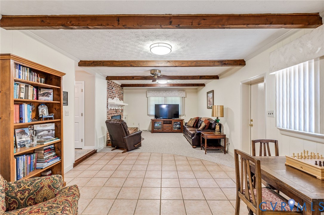 5700 Elfinwood Road Chester, VA 23831 - Photo 20 of 38 a living room with furniture and a book shelf
