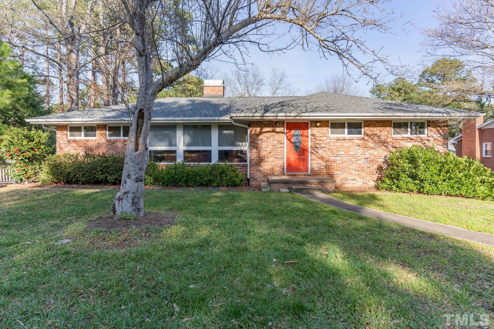 827 Athens Drive Raleigh, NC 27606 - Photo 1 of 34 front view of house with a yard