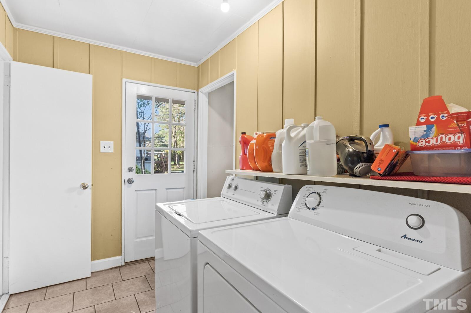 827 Athens Drive Raleigh, NC 27606 - Photo 11 of 34 a utility room with dryer and washer