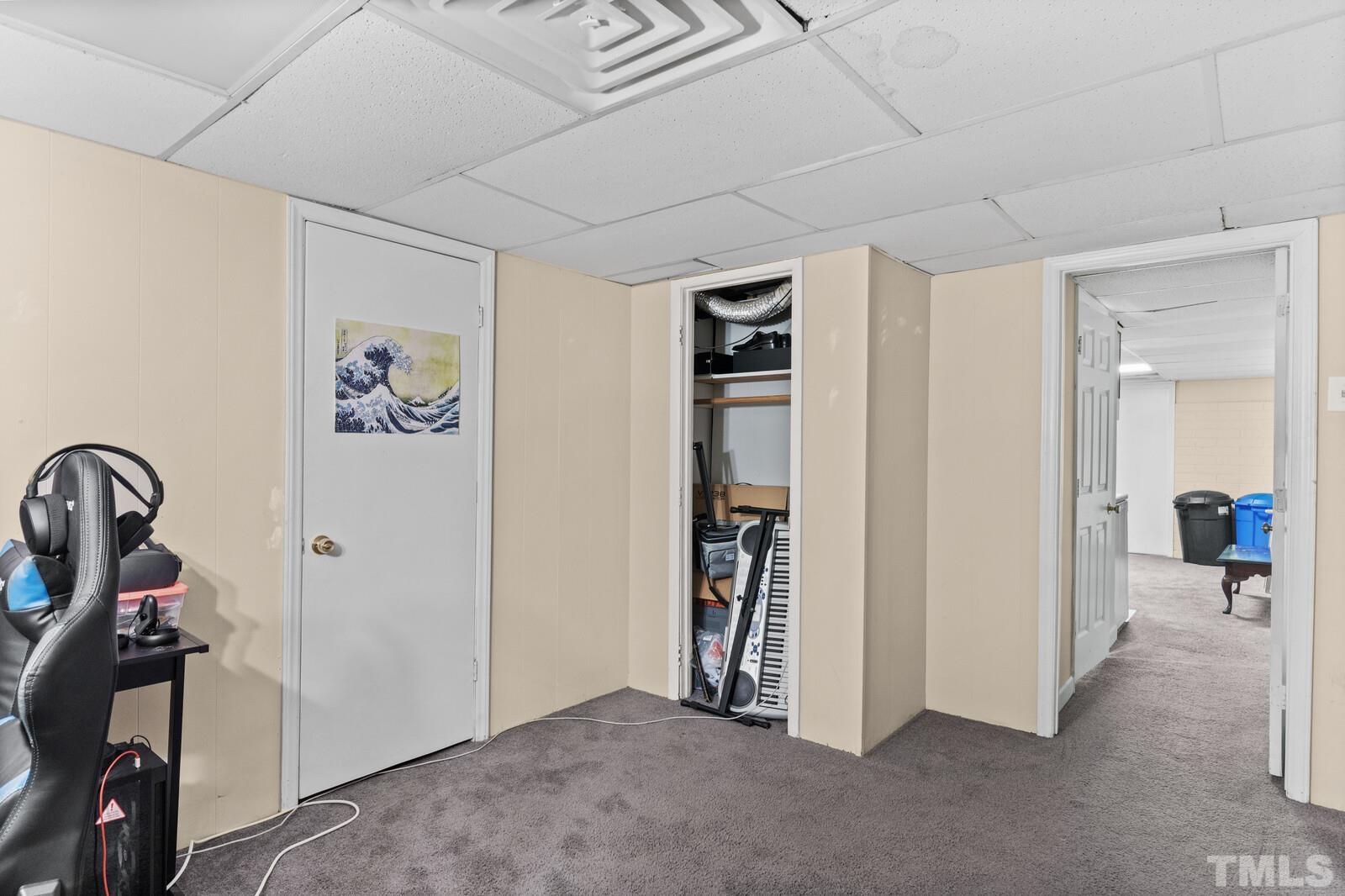 827 Athens Drive Raleigh, NC 27606 - Photo 23 of 34 a view of a room with gym equipment