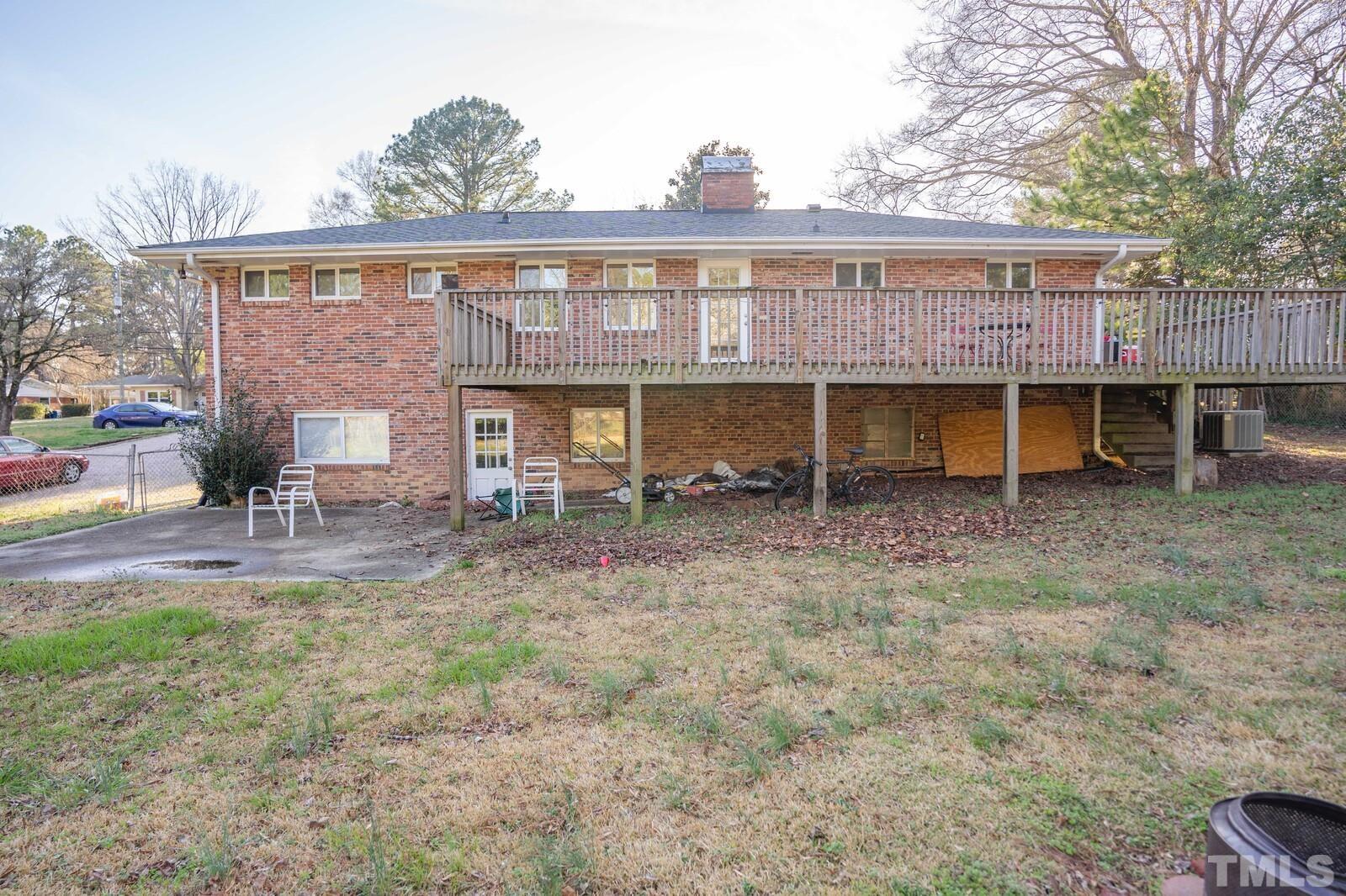 827 Athens Drive Raleigh, NC 27606 - Photo 29 of 34 a view of a house with backyard porch and sitting area