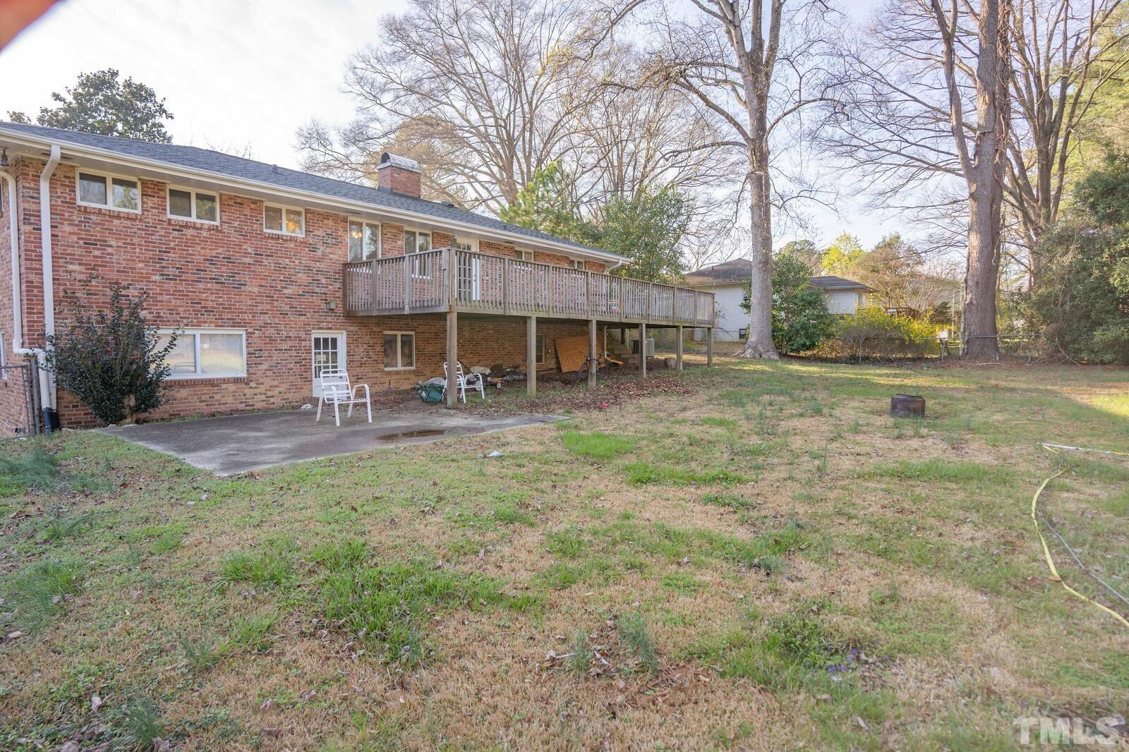827 Athens Drive Raleigh, NC 27606 - Photo 30 of 34 front view of a house with a yard