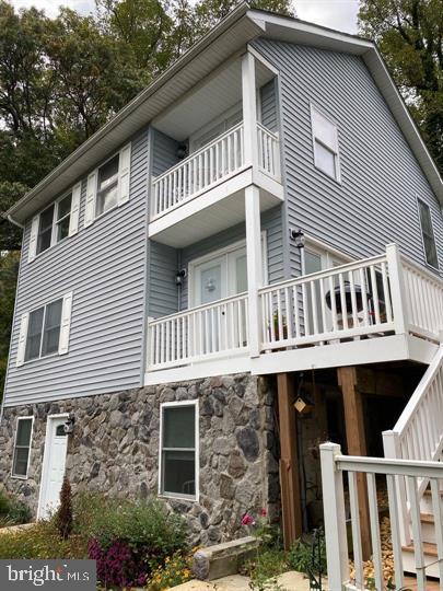 a front view of a house with balcony