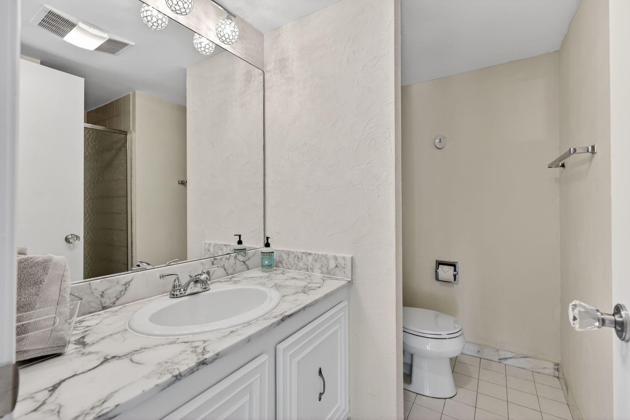 3400 North Ocean Drive, Unit 408 Singer Island, FL 33404 - Photo 11 of 31 a bathroom with a granite countertop sink toilet and shower