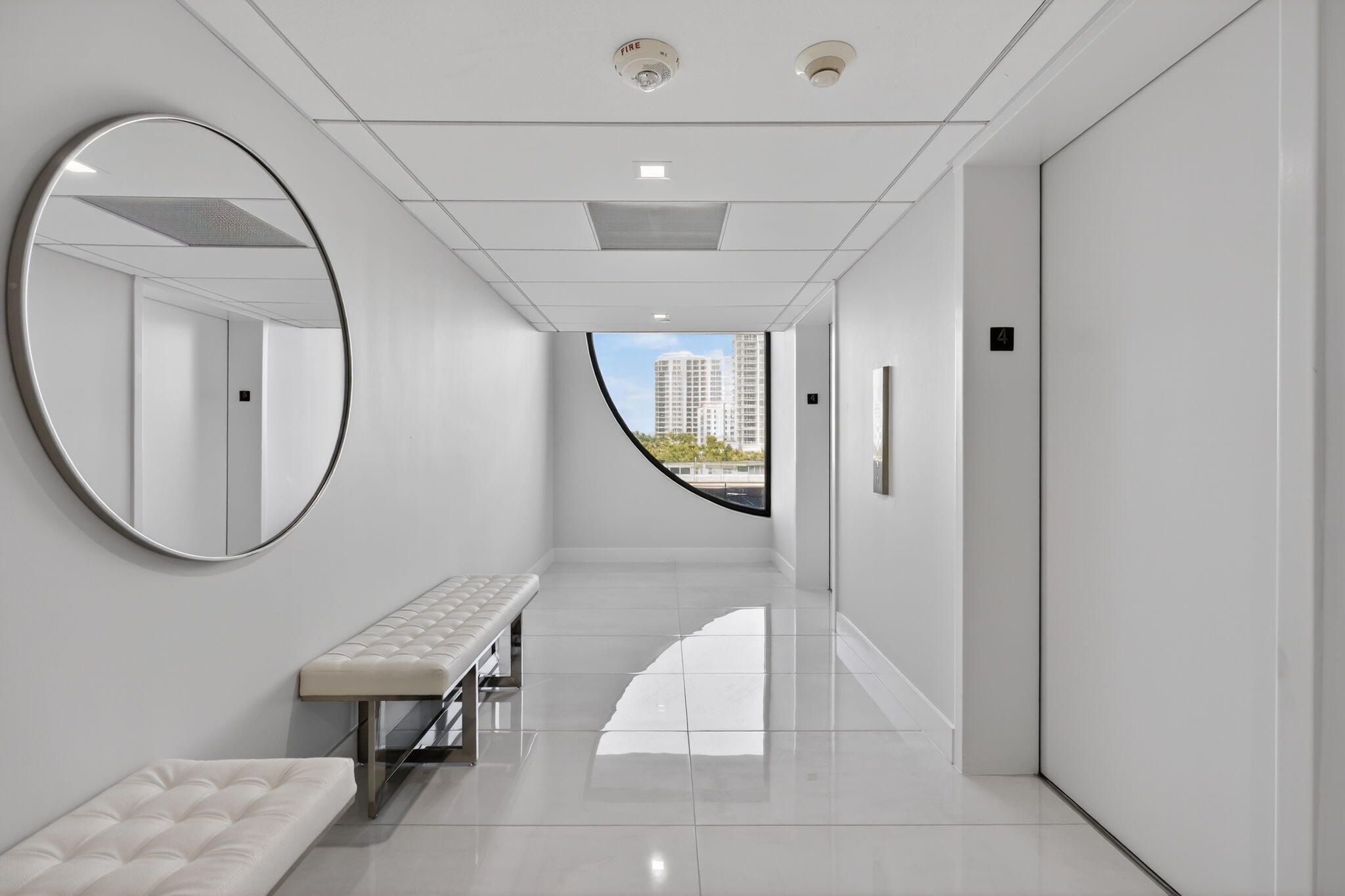 3400 North Ocean Drive, Unit 408 Singer Island, FL 33404 - Photo 14 of 31 a view of a livingroom with furniture and mirror