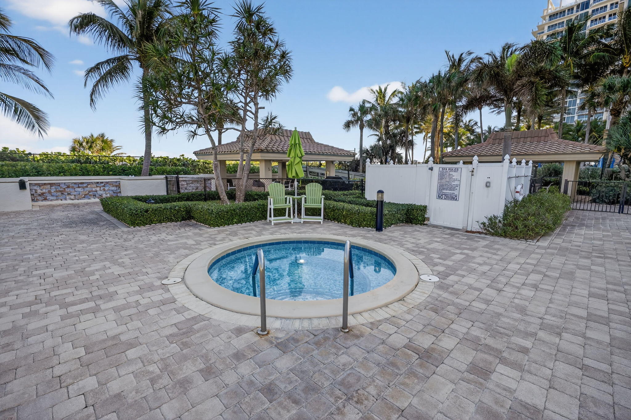 3400 North Ocean Drive, Unit 408 Singer Island, FL 33404 - Photo 24 of 31 front view of a house with a yard and potted plants