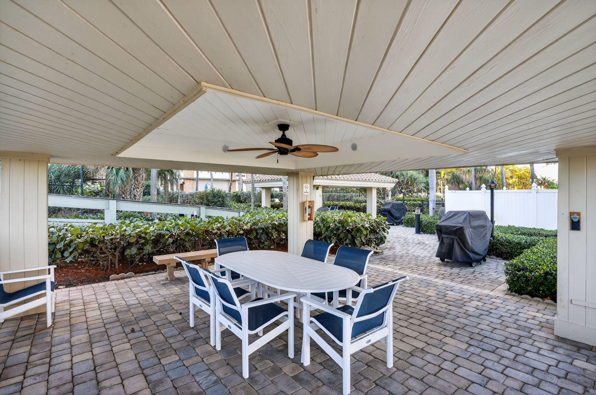 3400 North Ocean Drive, Unit 408 Singer Island, FL 33404 - Photo 25 of 31 a patio with a patio table and chairs