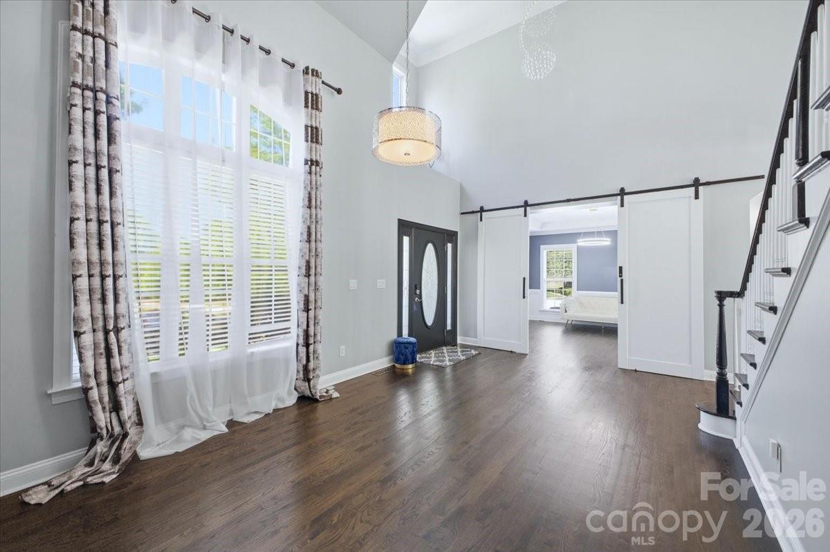 1825 Laveta Road Charlotte, NC 28269 - Photo 7 of 48 a view of an entryway with wooden floor