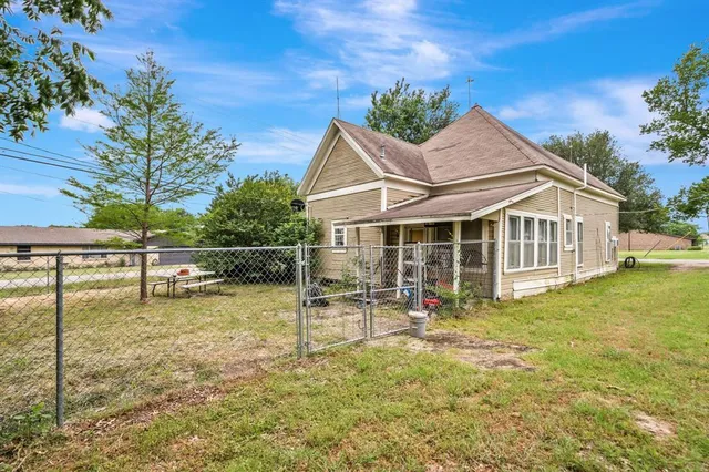 a view of outdoor space with deck and trees