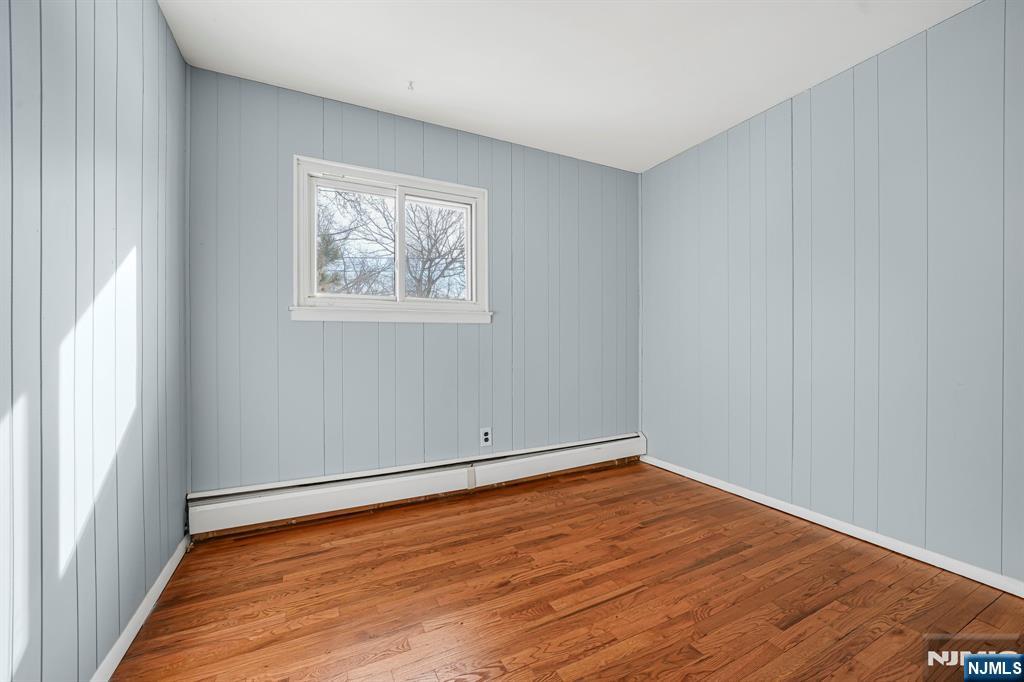645 Wildwood Road West Northvale, NJ 07647 - Photo 23 of 35 a view of an empty room with wooden floor and a window