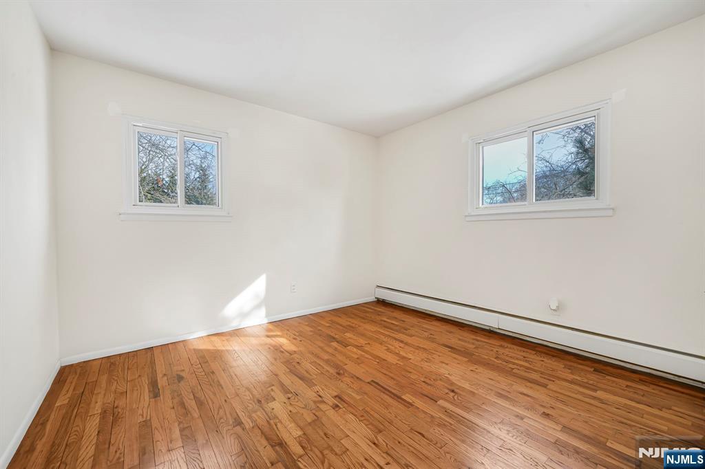 645 Wildwood Road West Northvale, NJ 07647 - Photo 24 of 35 a view of an empty room with wooden floor and a window