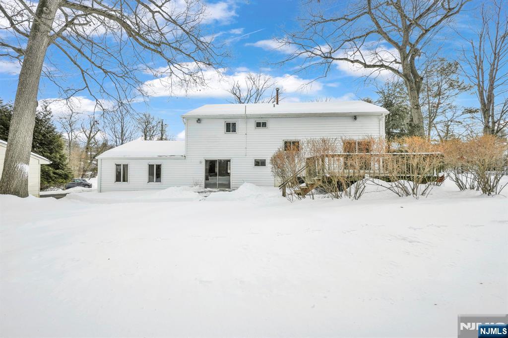 645 Wildwood Road West Northvale, NJ 07647 - Photo 32 of 35 a view of a house with a snow in the yard