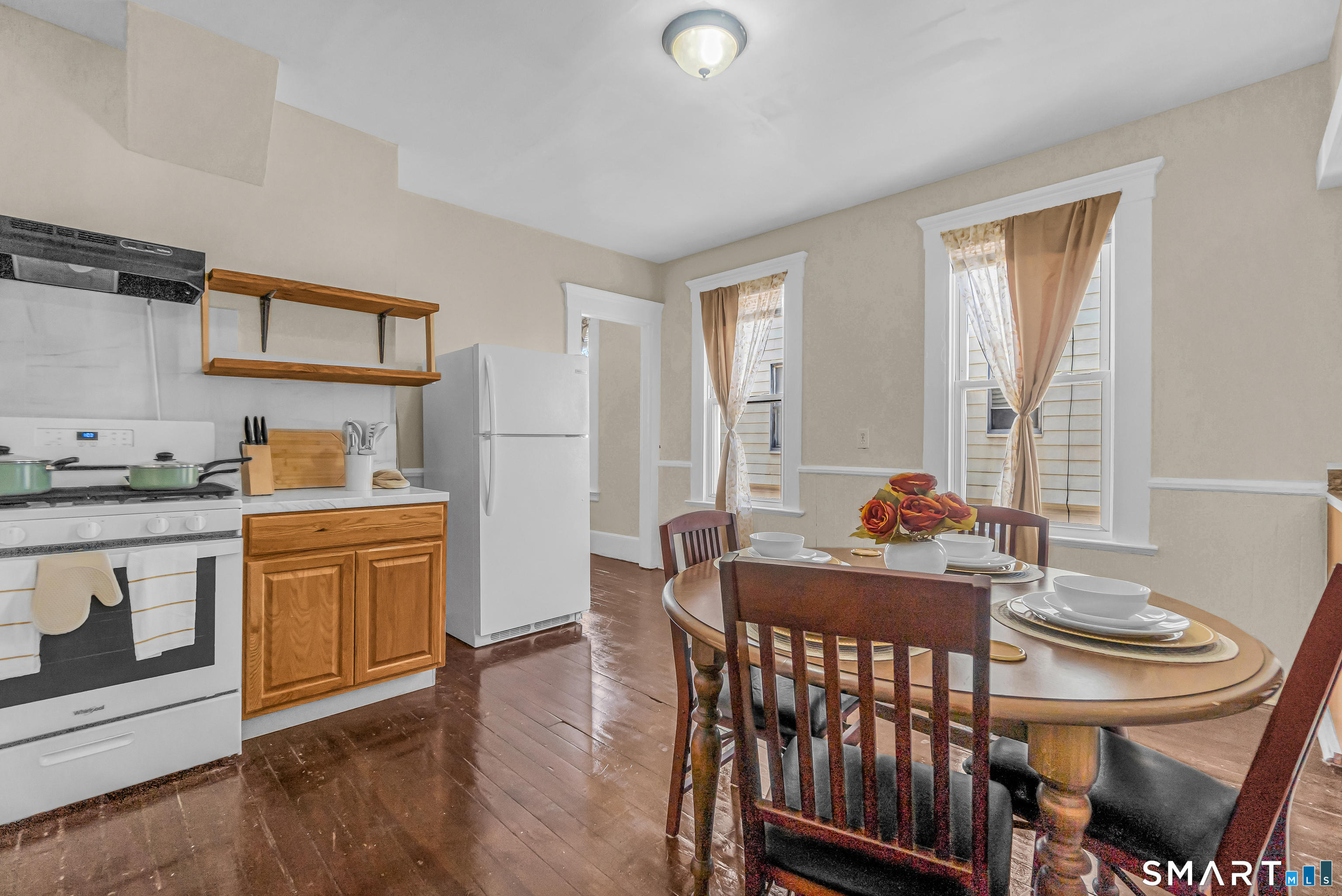 766 George Street New Haven, CT 06511 - Photo 8 of 23 a kitchen with a table chairs and wooden floor