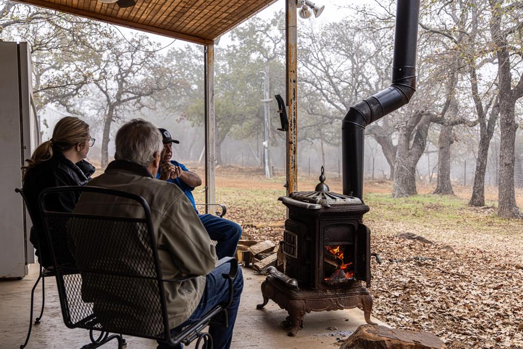 2946 Fm 52 Graford, TX 76449 - Photo 10 of 40 a view of a porch with furniture and a fire pit