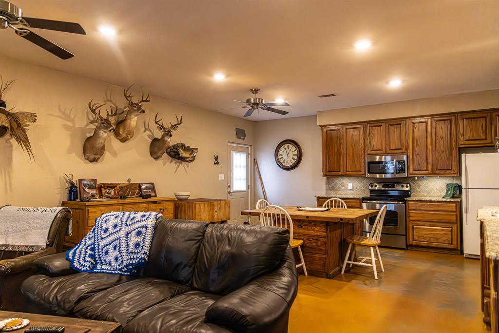 2946 Fm 52 Graford, TX 76449 - Photo 38 of 40 a living room with furniture and a flat screen tv