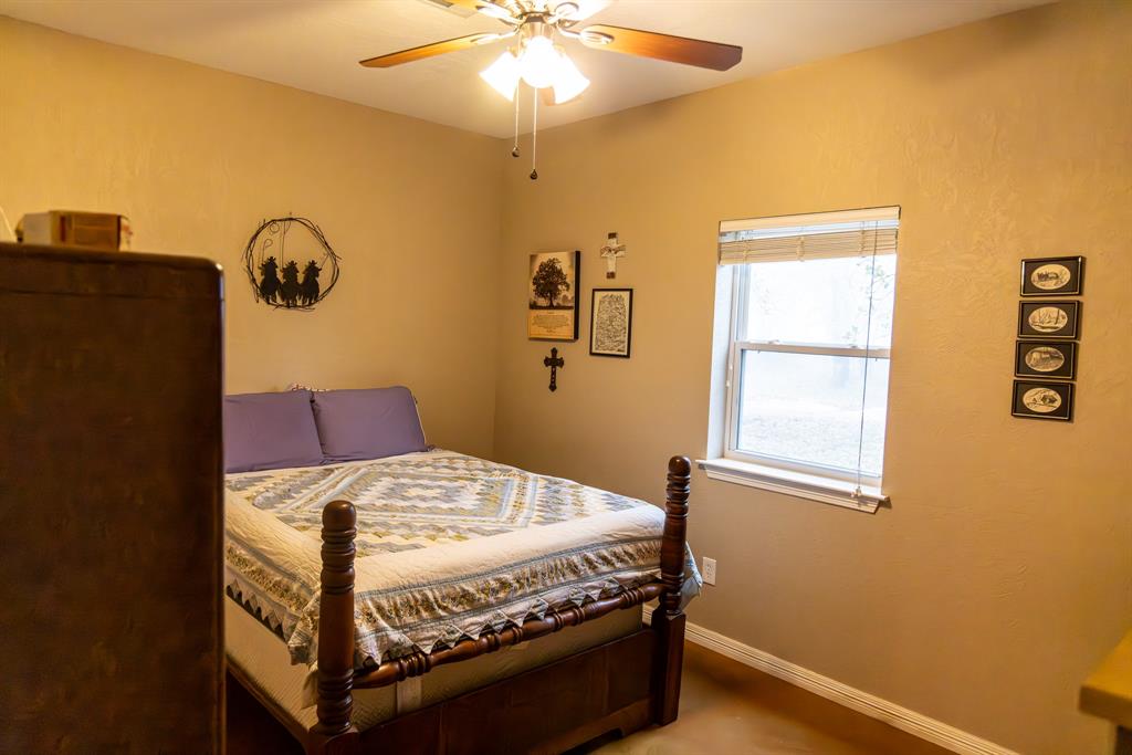 2946 Fm 52 Graford, TX 76449 - Photo 6 of 40 a bedroom with a bed and a window