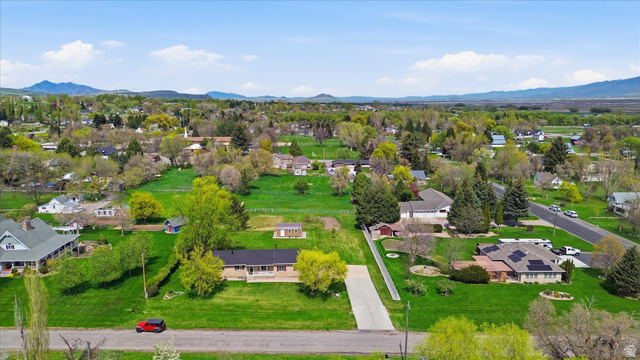 45 West 100 South Mendon, UT 84325 - Photo 50 of 64 Aerial view of residential area featuring a mountainous background