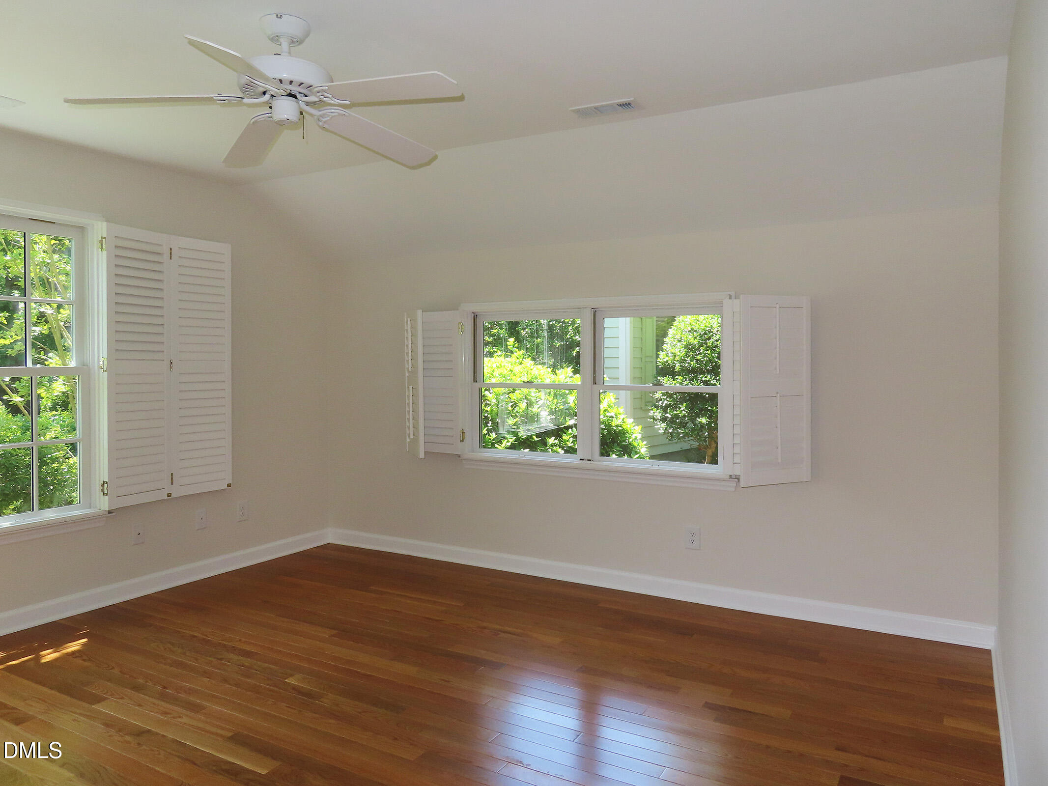 120 Weatherhill Point Carrboro, NC 27510 - Photo 13 of 25 an empty room with wooden floor fan and windows