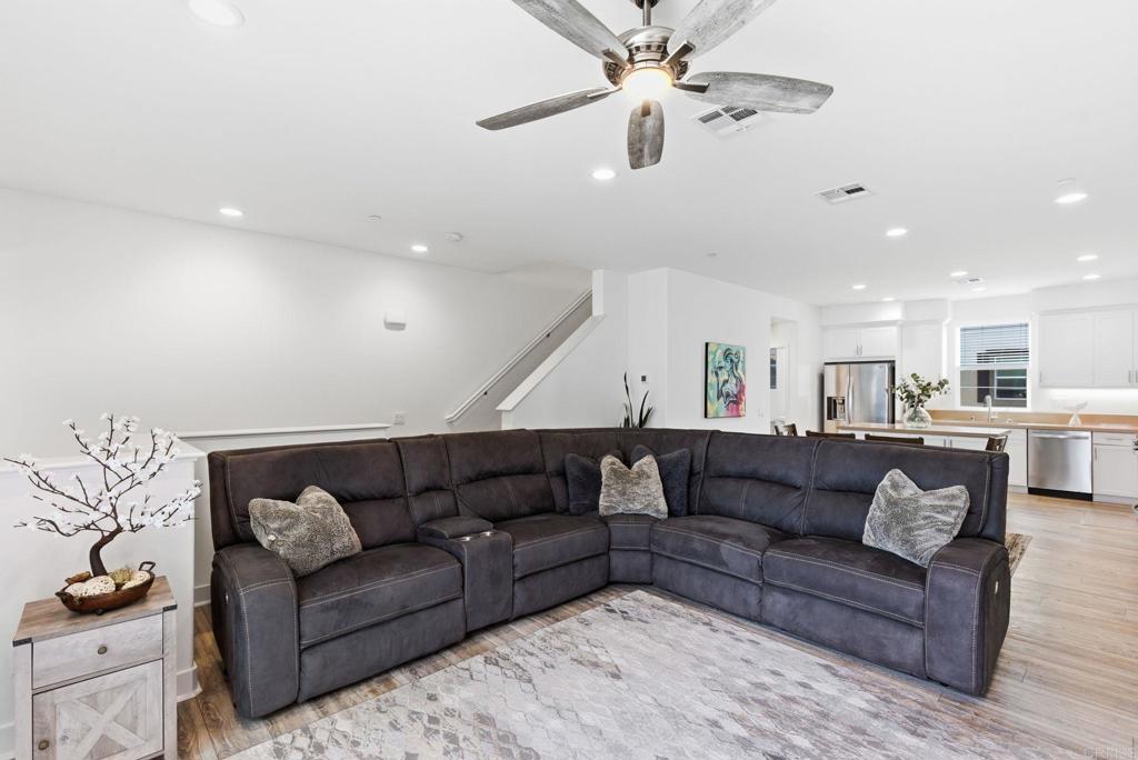 4367 Pacifica Way, Unit 2 Oceanside, CA 92056 - Photo 15 of 37 a living room with furniture and a ceiling fan