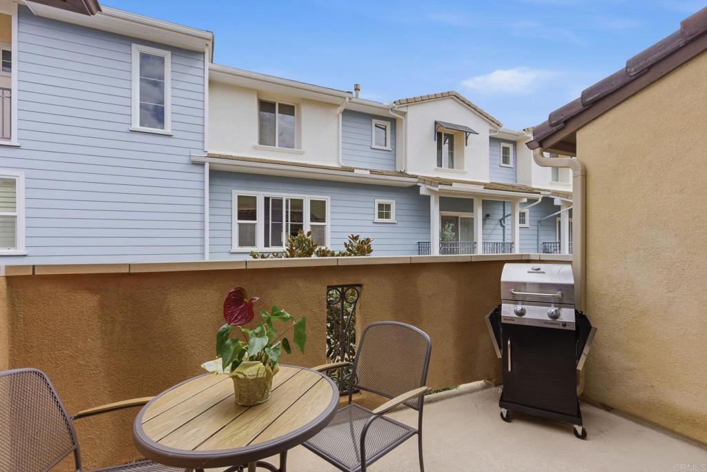 4367 Pacifica Way, Unit 2 Oceanside, CA 92056 - Photo 17 of 37 a backyard of a house with table and chairs